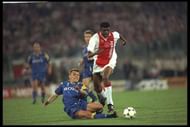 23 May 1996: Nwankwo Kanu of Ajax is challenged by Dider Deschkrips of Juventus during the European Cup Final in Amsterdam, Netherlands. The game went to penaltys after full time the score was 1-1 and Juventus won the penaltys 4-2. \ \ Mandatory Credit:Shaun Botterill /Allsport