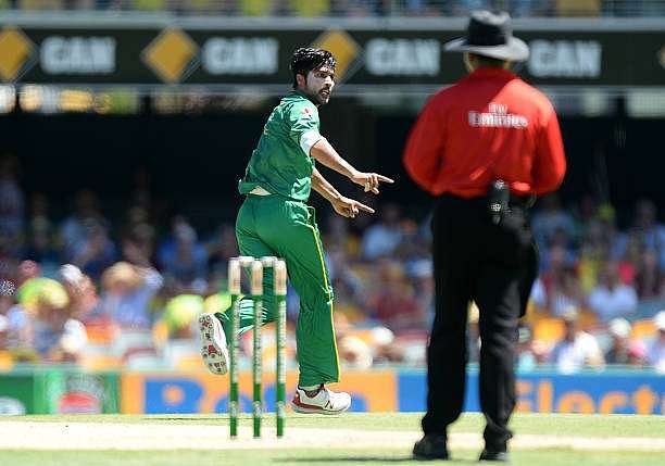 BRISBANE, AUSTRALIA - JANUARY 13:  Mohammad Amir of Pakistan celebrates taking the wicket of David Warner of Australia during game one of the One Day International series between Australia and Pakistan at The Gabba on January 13, 2017 in Brisbane, Australia.  (Photo by Bradley Kanaris/Getty Images)