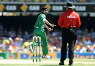 BRISBANE, AUSTRALIA - JANUARY 13: Mohammad Amir of Pakistan celebrates taking the wicket of David Warner of Australia during game one of the One Day International series between Australia and Pakistan at The Gabba on January 13, 2017 in Brisbane, Australia. (Photo by Bradley Kanaris/Getty Images)