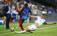 PARIS, FRANCE - JUNE 13: Ousmane Dembele of France is tackled by Gary Cahill of England during the International Friendly match between France and England at Stade de France on June 13, 2017 in Paris, France. (Photo by Julian Finney/Getty Images)