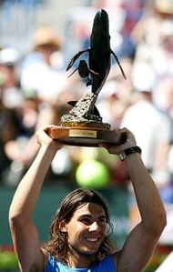 INDIAN WELLS, CA - MARCH 18: Rafael Nadal of Spain holds up the championship trophy after defeating Novak Djokovic of Serbia in the final of the Pacific Life Open on March 18, 2007 at the Indian Wells Tennis Garden in Indian Wells, California. Nadal defeated Djokovic 6-2, 7-5. (Photo by Harry How/Getty Images)