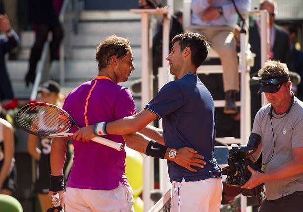 MADRID, SPAIN - MAY 13:  Rafael Nadal of Spain is congratulated by Novak Djokovic of Serbia after winning the semi-finals match during day eight of the Mutua Madrid Open tennis at La Caja Magica on May 13, 2017 in Madrid, Spain.  (Photo by Denis Doyle/Getty Images)