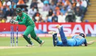 BIRMINGHAM, ENGLAND - JUNE 04: Sarfraz Ahmed of Pakistan removes the bails to run out Rohit Sharma of India during the ICC Champions Trophy match between India and Pakistan at Edgbaston on June 4, 2017 in Birmingham, England. (Photo by Michael Steele/Getty Images)