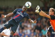 VIENNA, AUSTRIA - JULY 12: Serge Aurier of Paris Saint-Germain (L) competes for the ball in the air with Goalkeeper David Kraft of Wiener Sportklub during the Friendly Match between Wiener Sportklub and Paris Saint-Germain at Sportclub Platz on July 12, 2015 in Vienna, Austria. (Photo by Christian Hofer/Getty Images)