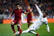 MADRID, SPAIN - MARCH 08: Sergio Ramos of Real Madrid tackles Mohamed Salah of Roma during the UEFA Champions League Round of 16 Second Leg match between Real Madrid and Roma at Estadio Santiago Bernabeu on March 8, 2016 in Madrid, Spain. (Photo by Gonzalo Arroyo Moreno/Getty Images)