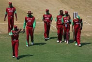 TRELAWNY, JAMAICA - MARCH 09: The West Indies team led by Brian Lara (2L) and Courtney Walsh look dejected as they walk off following defeat to India during the ICC Cricket World Cup 2007 Warm Up Match between West Indies and India at the Trelawny Multi Purpose Stadium on March 9, 2007 in Trelawny, Jamaica. (Photo by Paul Gilham/Getty Images)