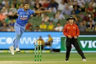 MELBOURNE, AUSTRALIA - JANUARY 17: Umesh Yadav of India attempts to stop the ball during game three of the One Day International Series between Australia and India at Melbourne Cricket Ground on January 17, 2016 in Melbourne, Australia. (Photo by Darrian Traynor/Getty Images)