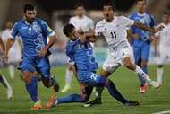 TEHRAN, IRAN - JUNE 12: Vahid Amiri of Iran and Shomorodov Eldor in action during FIFA 2018 World Cup Qualifier match between Iran and Uzbekistan at Azadi Stadium on June 12, 2017 in Tehran, Iran. (Photo by Amin M. Jamali/Getty Images)