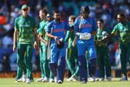 LONDON, ENGLAND - JUNE 11: Virat Kohli and Yuvraj Singh of India in leave the field after India win the ICC Champions trophy cricket match between India and South Africa at The Oval in London on June 11, 2017 (Photo by Clive Rose/Getty Images)