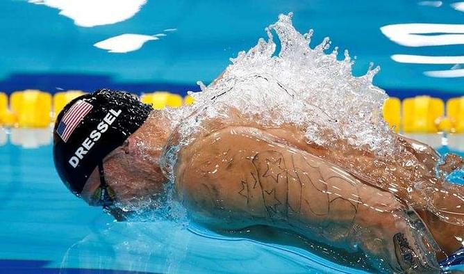 Swimming: Dressel makes history with three world golds in one night