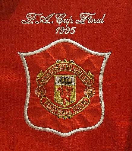 The &acirc;Red Devil&acirc; crest as it appeared on the kit for the 1995 FA Cup final