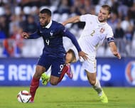 BELGRADE, SERBIA - SEPTEMBER 07: Alexandre Lacazette (L) of France is challenged by Branislav Ivanovic (R) of Serbia during the International friendly match between Serbia and France at the Stadium JNA on September 07, 2014 in Belgrade, Serbia, 2014. (Photo by Srdjan Stevanovic/Getty Images)