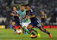 SEVILLE, SPAIN - SEPTEMBER 19: Alexandre Lacazette (R) of Olympique Lyonnais and Markus Steinhofer of Real Betis Balompie in action during the UEFA Europa League group stage match between Real Betis Balompie and Olympique Lyonnais held on September 19, 2013 at the Benito Villamarin Stadium, in Seville, Spain. (Photo by Jorge Guerrero/EuroFootball/Getty Images)