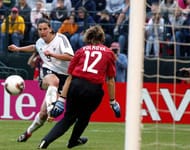 Birgit Prinz #9 of Germany scores a goal past Russia's Alla Volkova October 2, 2003, at PGE Park in Portland, Oregon. Germany defeated Russia 7-1 in The 2003 Women's World Cup Quarterfinal match. (Photo by Tom Hauck/Getty Images)