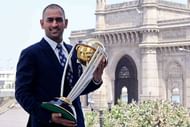 MUMBAI, INDIA - APRIL 03: India's cricket team captain Mahendra Singh Dhoni poses with the ICC Cricket World Cup Trophy, with the Gateway of India in the backdrop, during a photo call at the Taj Palace Hotel on April 3, 2011 in Mumbai, India. (Photo by Ritam Banerjee/Getty Images)