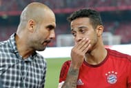 BEIJING, CHINA - JULY 18: Josep Guardiola, head coach of FC Bayern Muenchen talks to his player Thiago during the international friendly match between FC Bayern Muenchen and Valencia FC during the Audi Football Summit Beijing 2015 at National Stadium on July 18, 2015 in Beijing, China. (Photo by Lintao Zhang/Getty Images)