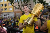 DORTMUND, GERMANY - MAY 28: Julian Weigl of Borussia Dortmund lifts the DFB Cup trophy as the team celebrates during a winner's parade at Borsigplatz on May 28, 2017 in Dortmund, Germany. (Photo by Pool - Getty Images)