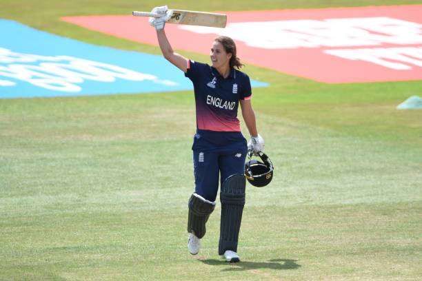 DERBY, ENGLAND - JULY 12: Natalie Sciver of England raises her bat after scoring one hundred runs during the ICC Women's World Cup 2017 between England and New Zealand at The 3aaa County Ground on July 12, 2017 in Derby, England. (Photo by Nathan Stirk/Getty Images)