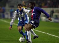 21 Nov 2000: Augustine Okocha of Paris is watched by a Deportivo La Coruna defender during the Champions League Group B match between Paris St Germain v Deportivo La Coruna at Parc des Princes, Paris, France. Mandatory Credit: Stu Forster/ALLSPORT