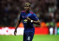 STOCKHOLM, SWEDEN - MAY 24: Paul Pogba of Manchester United points to the Manchester United badge on his kit following victory in the UEFA Europa League Final between Ajax and Manchester United at Friends Arena on May 24, 2017 in Stockholm, Sweden. (Photo by Julian Finney/Getty Images)