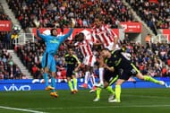 STOKE ON TRENT, ENGLAND - MAY 13: Peter Crouch of Stoke City scores his sides first goal past Petr Cech of Arsenal during the Premier League match between Stoke City and Arsenal at Bet365 Stadium on May 13, 2017 in Stoke on Trent, England. (Photo by Gareth Copley/Getty Images)
