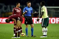 TURIN, ITALY - JANUARY 10: Referee Gianluca Rocchi speaks with Sulley Ali Muntari (R) of AC Milan during the Serie A match between Torino FC and AC Milan at Stadio Olimpico di Torino on January 10, 2015 in Turin, Italy. (Photo by Valerio Pennicino/Getty Images)