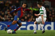 BARCELONA, SPAIN - MARCH 04: Ronaldinho of Barcelona gets past Mark Wilson of Celtic during the UEFA Champions League 2nd leg of the First knockout round match between FC Barcelona and Celtic at the Camp Nou stadium on March 4, 2007 in Barcelona, Spain. (Photo by Ryan Pierse/Getty Images)