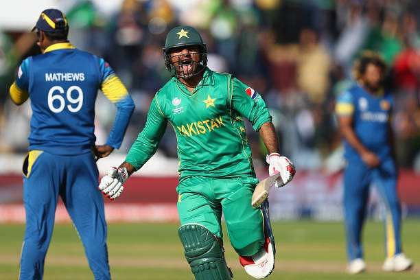 CARDIFF, WALES - JUNE 12:  Sarfraz Ahmed of Pakistan celebrates hitting the winning runs and victory by 3 wickets as Sri Lanka captain Angelo Mathews (L) looks on during the ICC Champions Trophy match between Sri Lanka and Pakistan at the SWALEC Stadium on June 12, 2017 in Cardiff, Wales.  (Photo by Michael Steele/Getty Images)