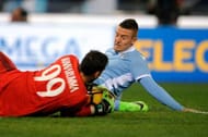 ROME, ROMA - FEBRUARY 13: Sergej Milinkovic Savic of SS Lazio competes for the ball with Gianluigi Donnaruma of AC Milan during the Serie A match between SS Lazio and AC Milan at Stadio Olimpico on February 13, 2017 in Rome, Italy. (Photo by Marco Rosi/Getty Images)
