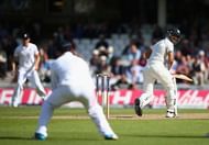 LONDON, ENGLAND - AUGUST 17: Virat Kohli of India looks back as he is caught out by Alastair Cook of England for 20 runs off the bowling of Chris Jordan of England during day three of the 5th Investec Test match between England and India at The Kia Oval on August 17, 2014 in London, England. (Photo by Paul Gilham/Getty Images)