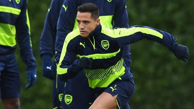 Sanchez back in Arsenal training with a smile