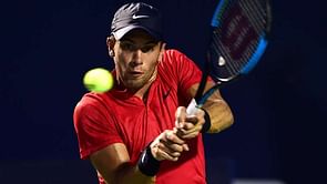 Coric stuns Isner, Bautista Agut eases through