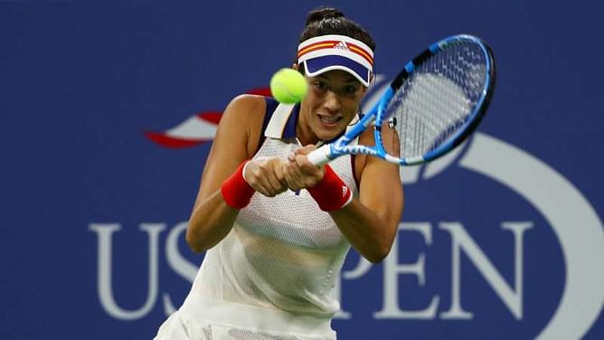 Muguruza, Sharapova advance on big day for Williams family