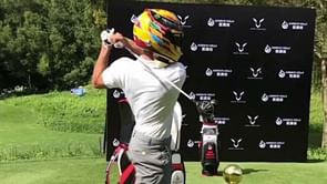 WATCH: Steph Curry plays golf in Lewis Hamilton's helmet