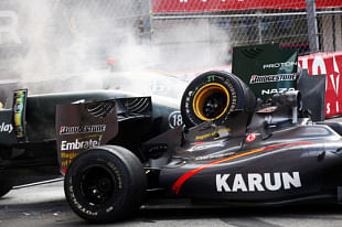 Trulli&#039;s Lotus car parked on top of Karun&#039;s HRT car @ Rascasse corner, F1 Monaco GP 2010