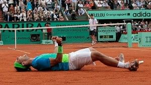 Rafael Nadal sinks into the Parisian clay after claiming his fifth Roland Garros title